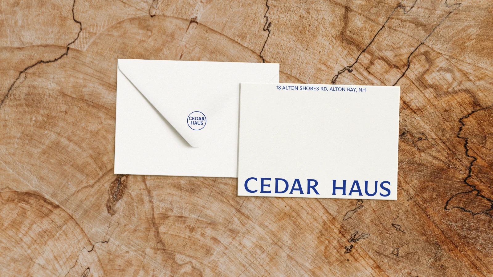 Envelope and notecard with Cedar Haus wordmark on wood
