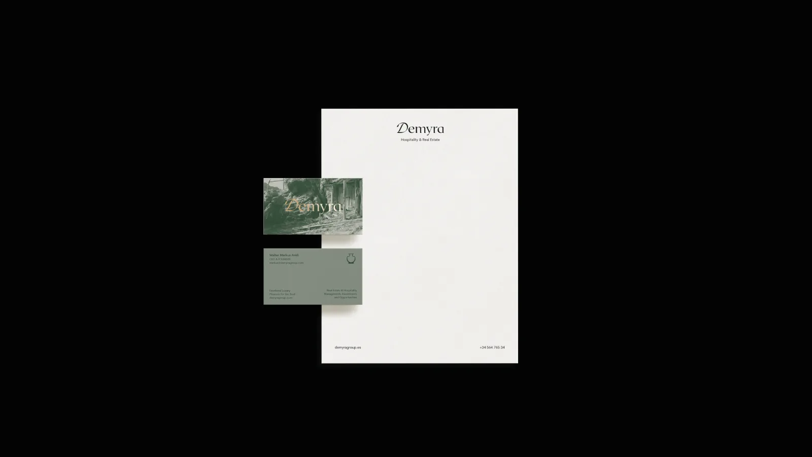 Letterhead with gold-embossed business cards on black