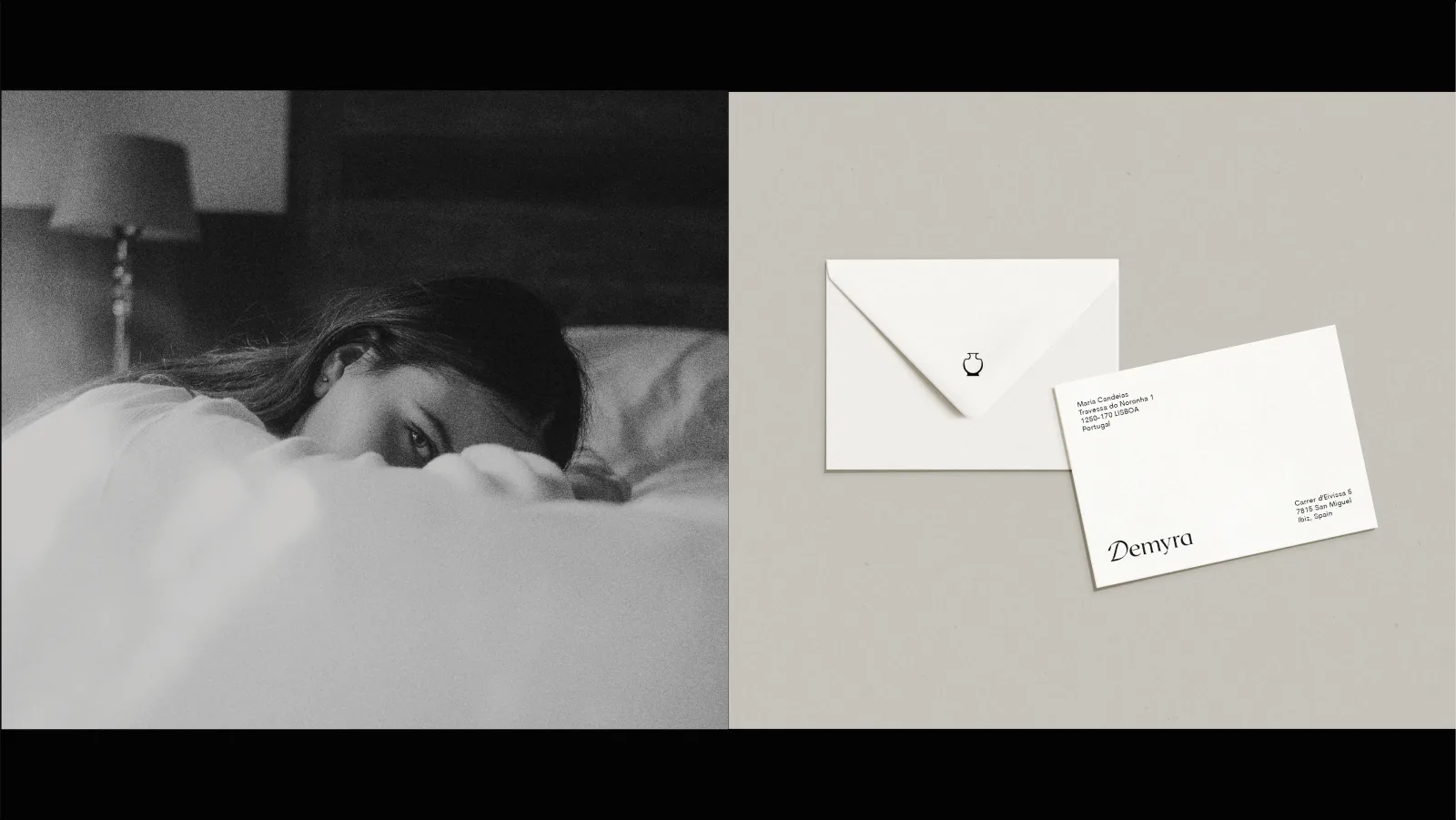 Black-and-white bedroom portrait beside Demyra envelope and postcard