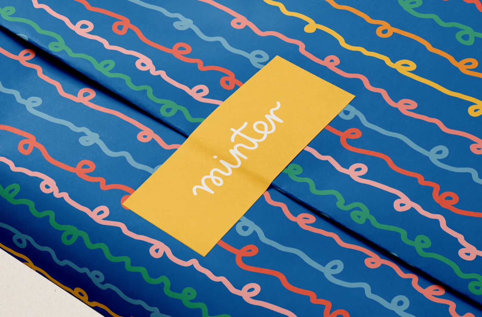 Tissue paper with knit loop pattern and brand sticker